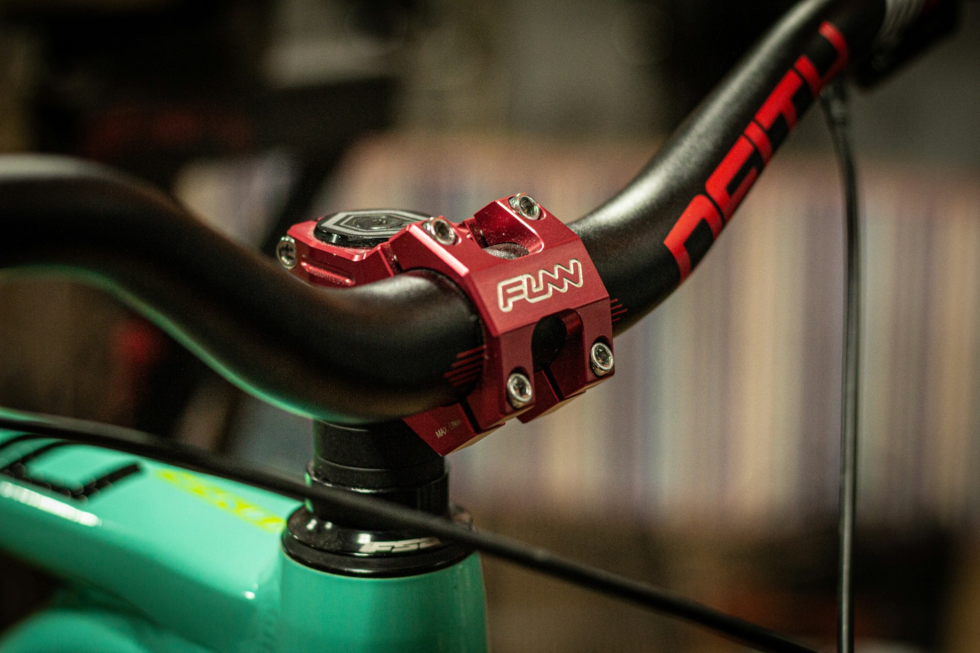 a close up of a bike handlebar with a blurry background